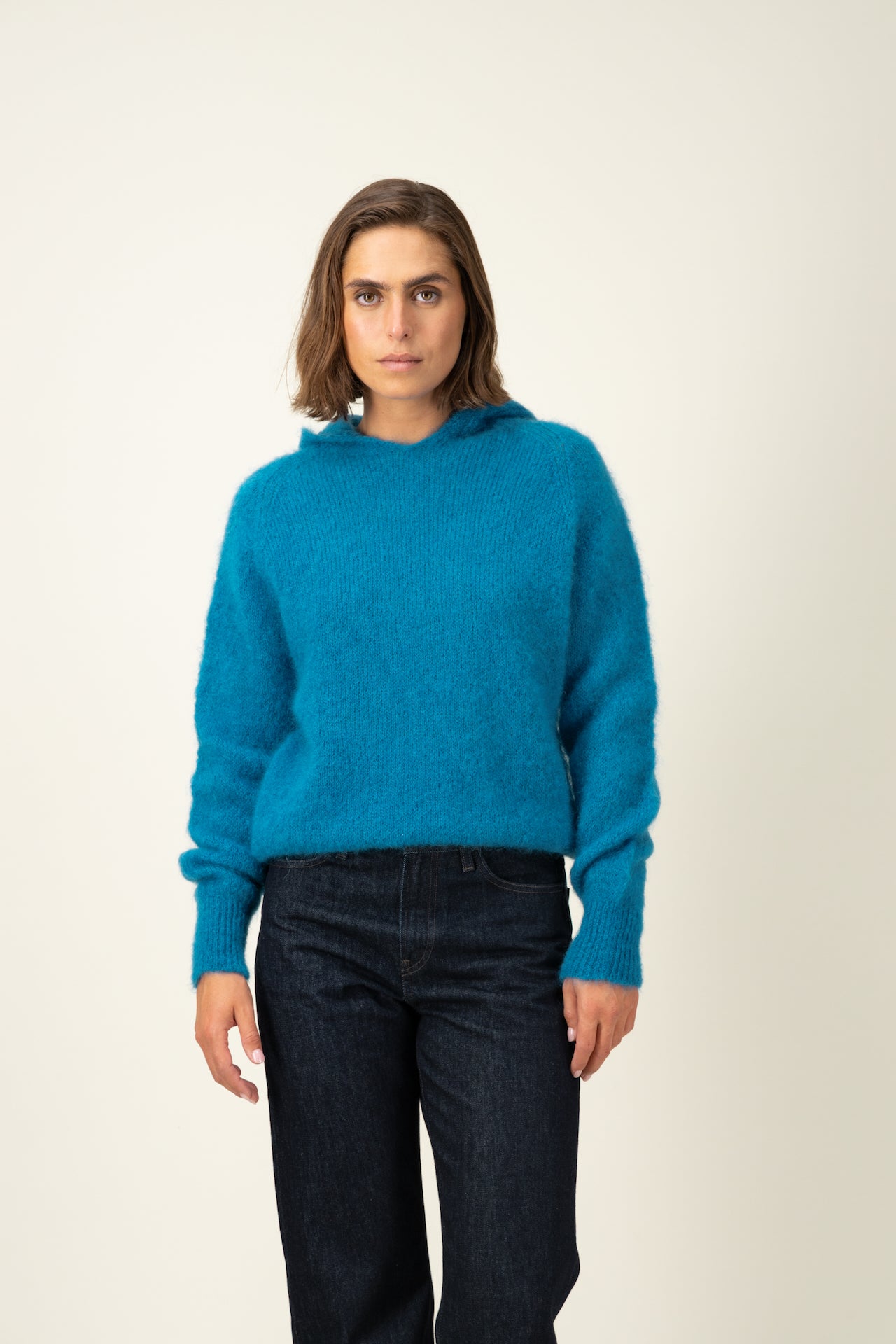 Produit Anouch capuche bleu canard confectionné par la marque Parisienne Tricots Jean Marc 1972.